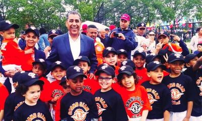 Congressman Espaillat posing with a group of youth from the Grand Slam Club